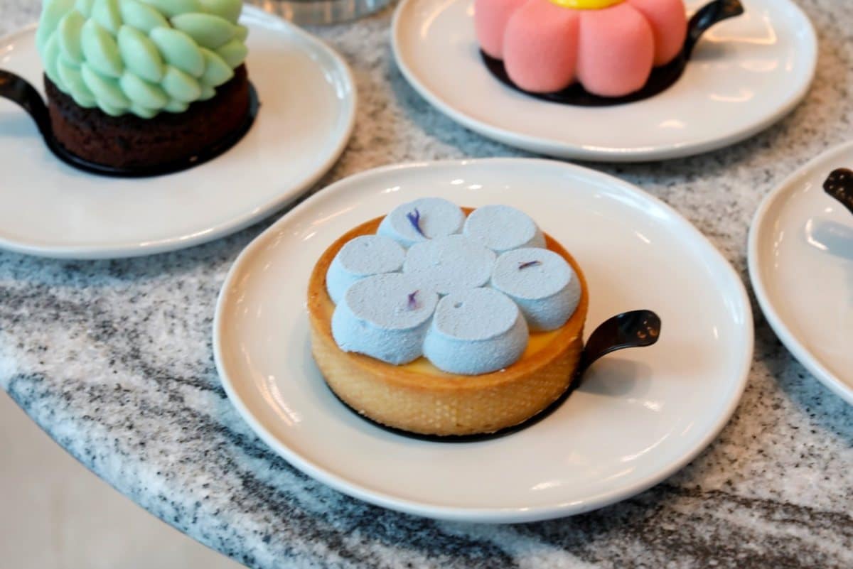 Lucine by LUNA’s Melon Berry tart topped with blue Chantilly cream and rock melon curd