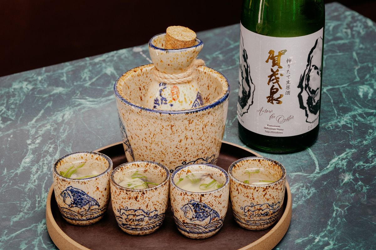 Hot Sake Oyster Shooter with Kamoizumi Shiboritate Nama Genshu at Cask and Shells
